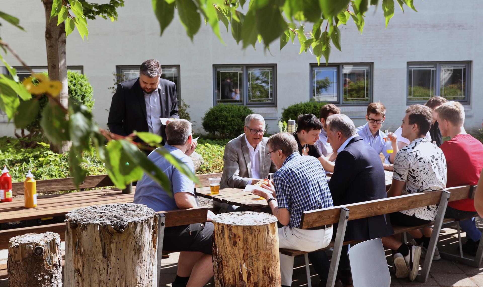 The reception was followed by hot dogs and cold beer in the department courtyard.